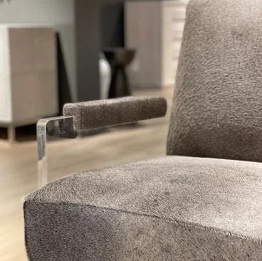Close view of a tailored lounge chair selected for material and proportion